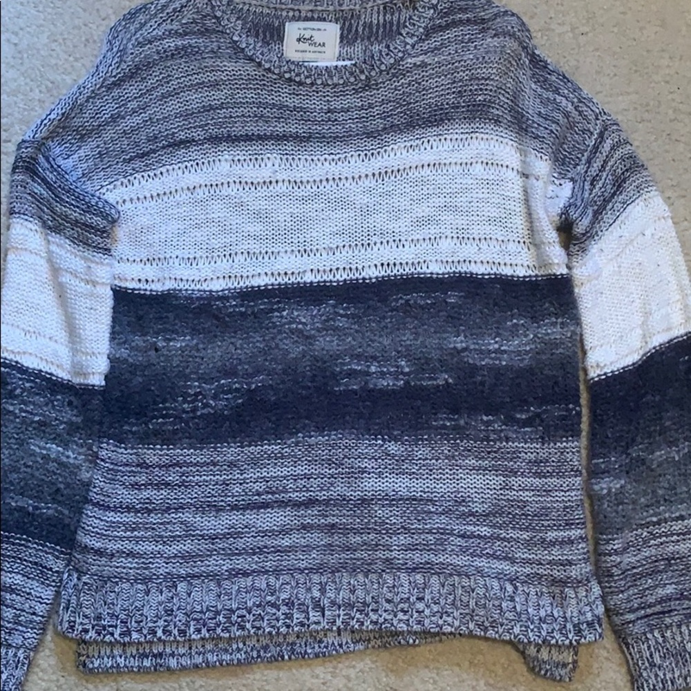 Blue and white color block striped sweater.